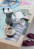 Espresso break on table with photos of urban landmarks under glass top