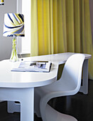 White modern desk with chair and patterned lamp