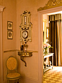 Antique barometer and door decoration in the hallway of a historic house