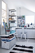 Practical shelving and baskets keeping shabby-chic workroom tidy