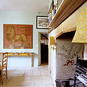 Living room with fireplace, lion painting and rustic decoration