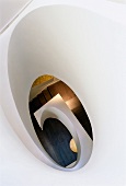 View down through oval, sculptural staircase