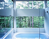 Bathroom with view of woods