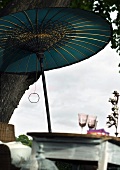 Garden table beneath Japanese parasol