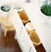 Chest of drawers with plant pots