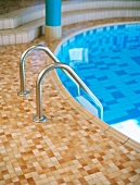 Swimming pool with ladder