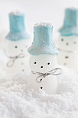 Little snowmen in snow