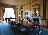 Dining room with fireplace in English manor house