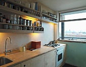 Kitchen with open shelving and window