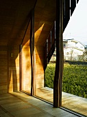 View of Japanese garden through glass wall
