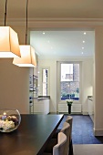 Old London building with view into modern fitted kitchen from dining area