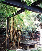 A low stone table on a terrace with steel supports