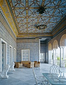 Sumptuous open-sided entrance loggia in North African style with seating and lion figures