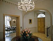 Foyer in traditional villa with open doorway and view into dining room