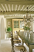 Provençal dining room with wrought iron chairs