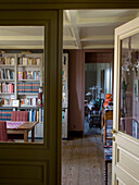 Room with bookshelf and dining table with chairs