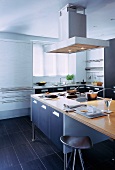 Simple fitted kitchen with designer kitchen island