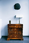 Antique chest of drawers with Art-Deco table lamp
