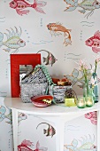 Fish pattern wallpaper and a side table