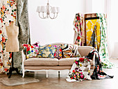 Various patterns on fabric cushions and loose cloth draped on antique sofa