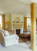 Traditional, country house living room with cosy open fire
