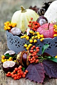 Zinc tray with conkers, apples, pumpkins and berries