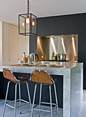 Marble kitchen island and bar stools with leather covers