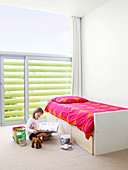 Girl's bedroom with louver blinds