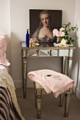 Baroque portrait of woman, perfume flagons and cut roses on antique, mirrored console table with matching stool