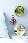 Original DIY clocks made from tin cans featuring coloured hands