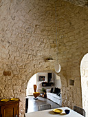 Dining room with stone vaulted ceiling and walls in a Trullo house