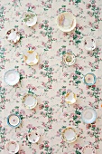 Ornamental plates on wall with floral wallpaper