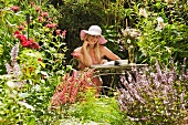 Woman reading book in garden