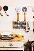 Kitchen utensils on a wall and on a vintage table