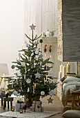 Christmas tree with wood and paper decorations
