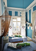 Child's bedroom with twin beds and blue walls