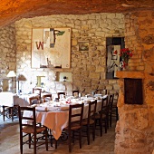 Set table in front of stone wall in dining room