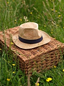 Straw hat on picnic basket