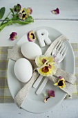 Place setting decorated with pansies & eggs