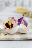 Easter table centrepiece with egg shells & pansies