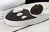 Yin and Yang dish with black pumice and white pebbles