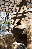 Outdoor stone oven near bbq grill
