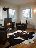 Living room with wood burning stove and animal skin rug