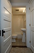 Doorway into bathroom with pedestal sink