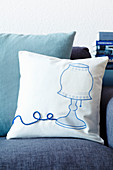 Scatter cushion with iron-on picture of lamp and appliqué cord as cable