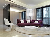 Elegant interior with classic chair and modern, purple sofa behind low, round table on rug