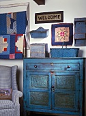 Vintage cabinet, armchair and ornamental items in various shades of blue