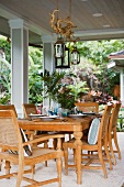 Outdoor dining area with wooden table and chairs