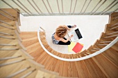 Woman using laptop on floor