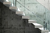 Concrete floating stairs with glass railing
